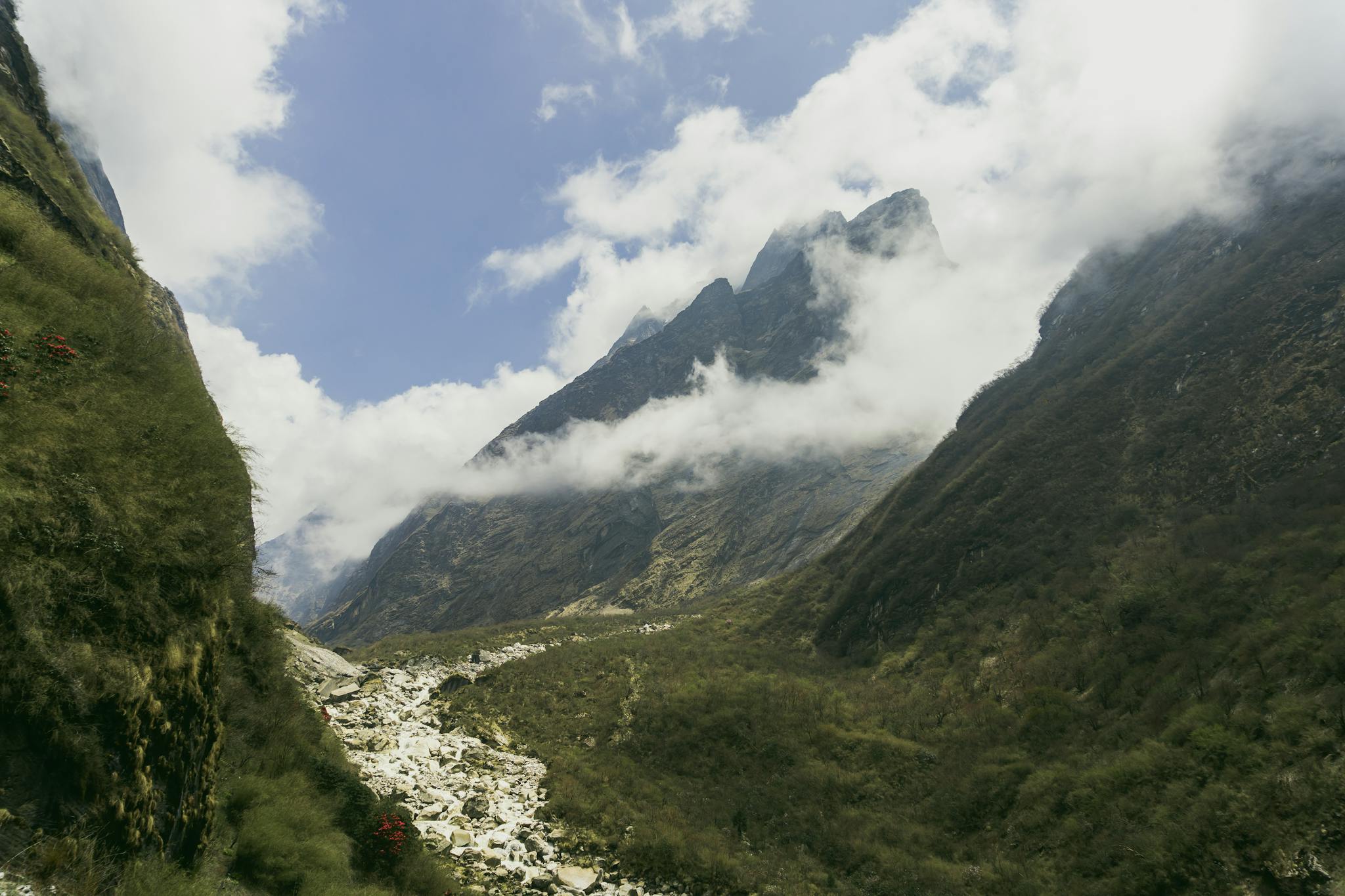 A breathtaking view of the Annapurna mountain range, showcasing lush valleys and dramatic peaks.